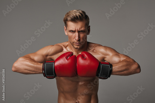 Determined sportsman in red gloves