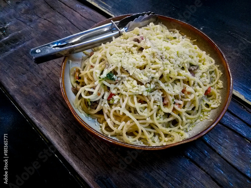 Mediterranean olive marinara sauce spaghetti on wooden tablen wooden table photo