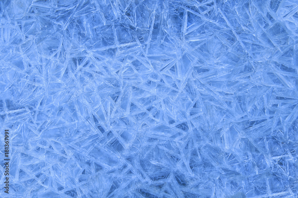 Frozen ice crystals. Simple white blue winter background