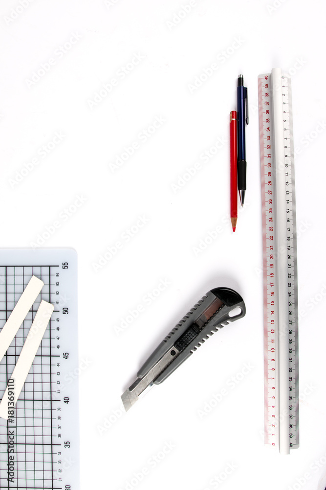 Graphic designer tools. Atelier equipment. Box cutter, cutting mat, pencil and ruler. Art Concept. Top view. Copy space. Graphic designer tools. Atelier equipment. Box cutter, cutting mat, pencil and ruler. Art Concept. Top view. Copy space.