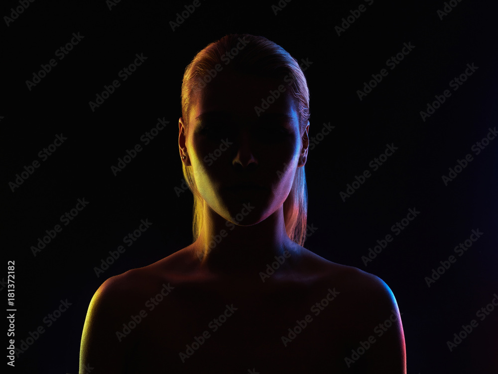 Fototapeta premium Rainbow woman silhouette, girl in colorful bright lights