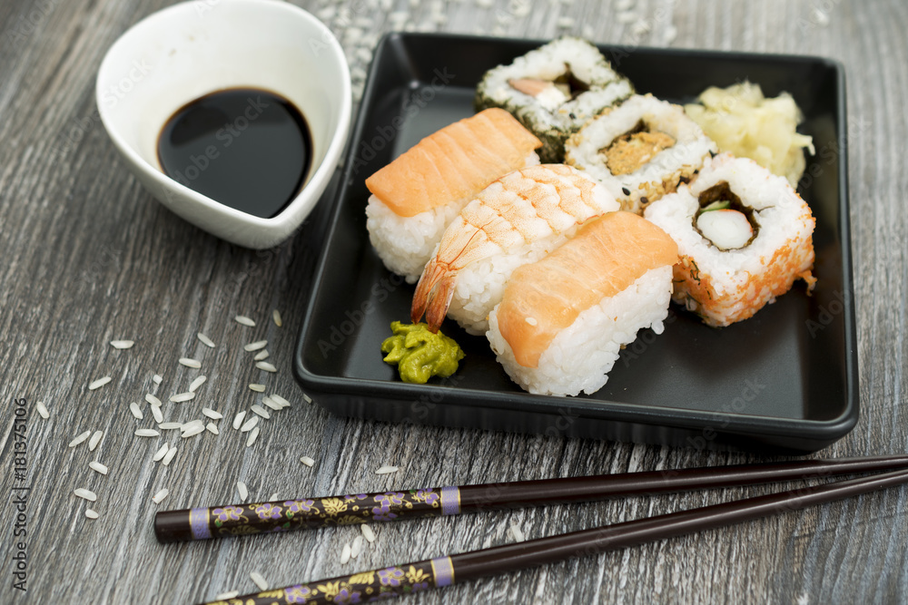 Set of sushi and chopsticks, traditional asian dishes. Set of sushi and chopsticks, traditional asian dishes.