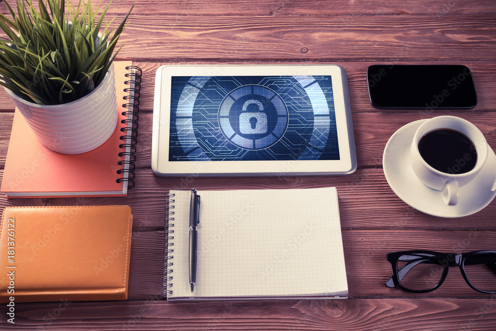 Web security and technology concept with tablet pc on wooden tab Web security and technology concept with tablet pc on wooden tab
