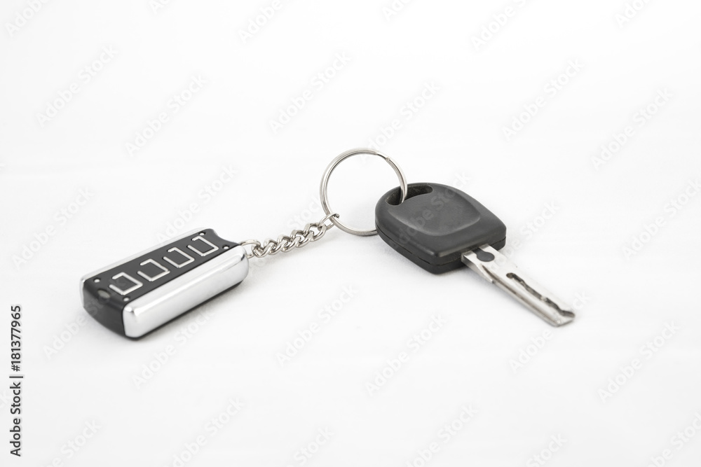 Car key and alarm system charm on a white background Car key and alarm system charm on a white background