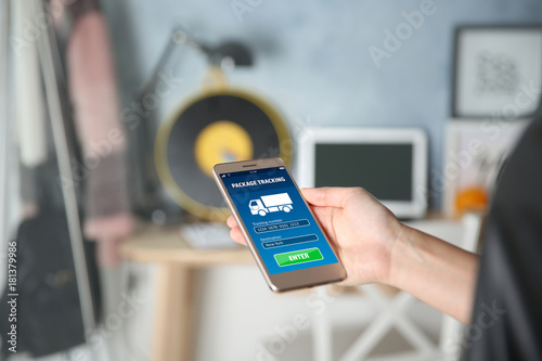 Woman holding modern cellph...