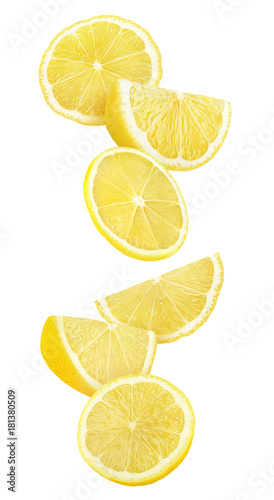 Isolated lemon slices in the air. Cut lemon fruit falling isolated on white background with clipping path