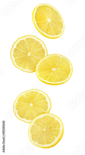 Isolated falling lemon pieces. Slices of lemon in the air isolated on white background with clipping path