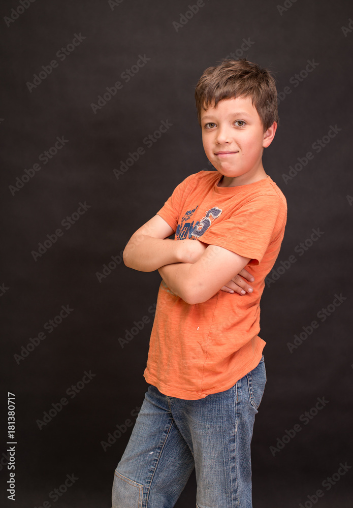 A boy portrait, young little cute and adorable kid, little obstreperous scamp. Poses, face expressions, ease, having fun, black background. - obrazy, fototapety, plakaty 
