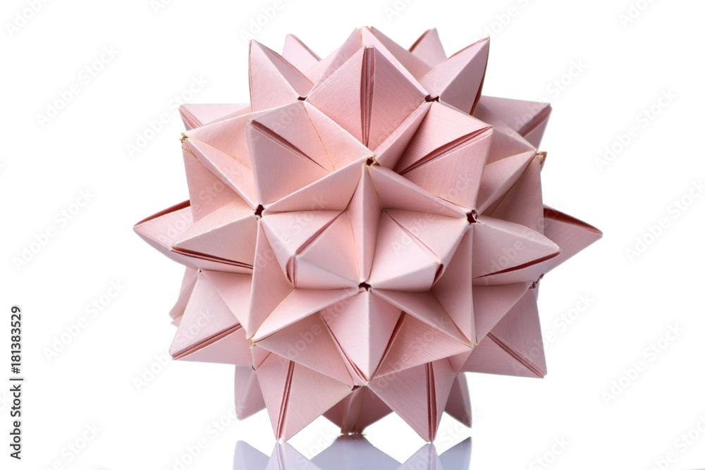 Spiky ball origami model. Wonderful figurine made of pink colored paper and assembled of many units. Spiky ball origami model. Wonderful figurine made of pink colored paper and assembled of many units.