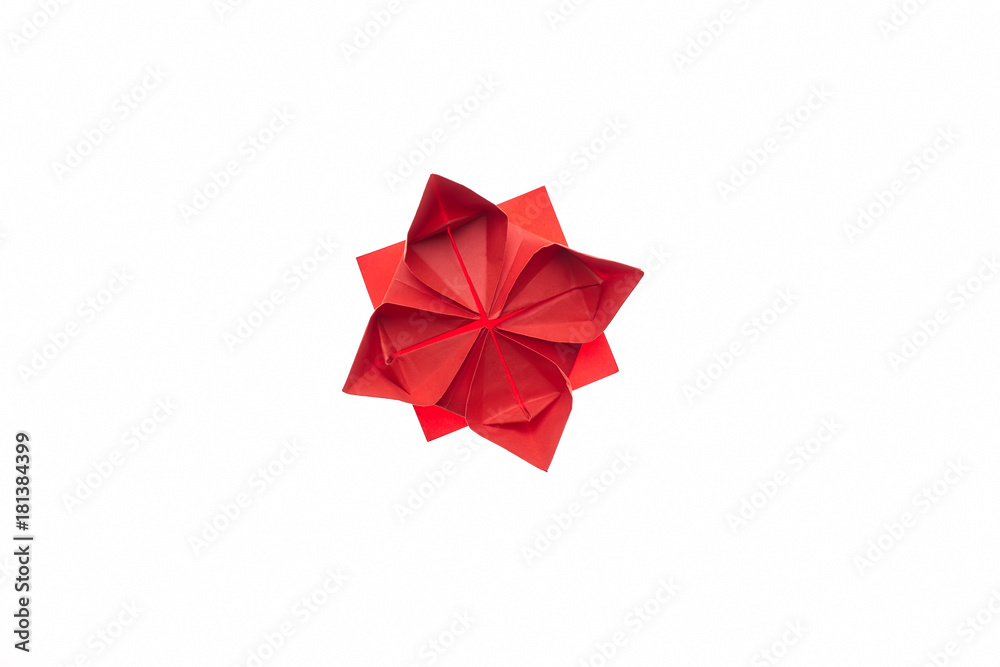 Lotus flower origami on white. Beautiful and simple model, folded red paper. Handmade ornaments, DIY, children's art. - obrazy, fototapety, plakaty 