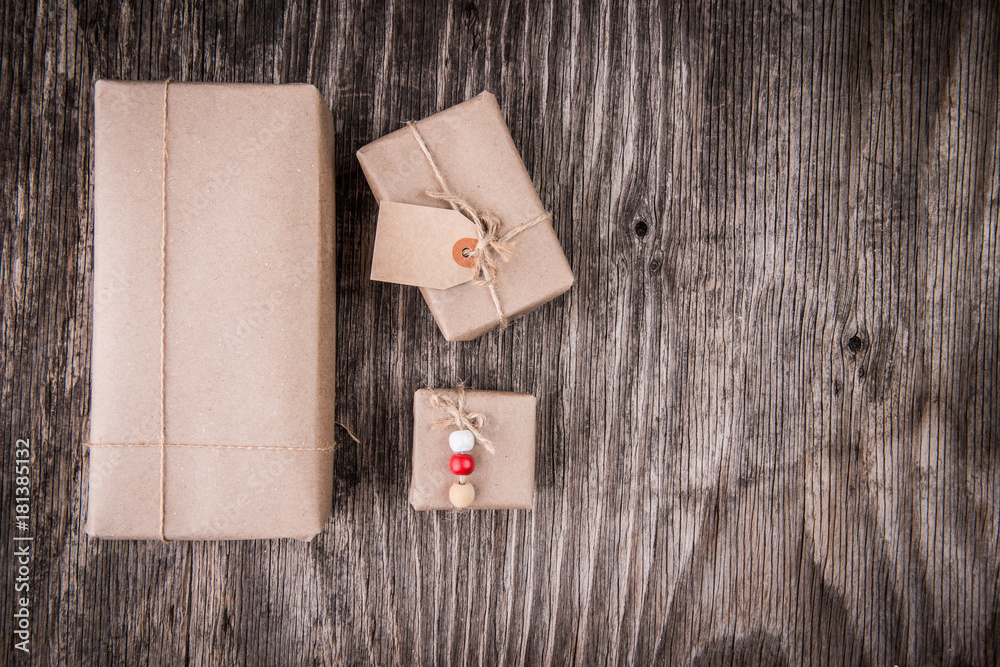 Creative gift boxes over rustic wood Creative gift boxes over rustic wood