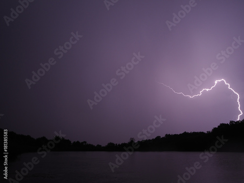 Lightning at the night lake
