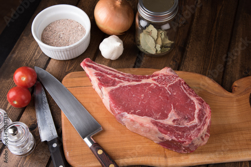 Raw Grass Fed Prime Rib Meat with Herbs, Vegetables and Spice Rub