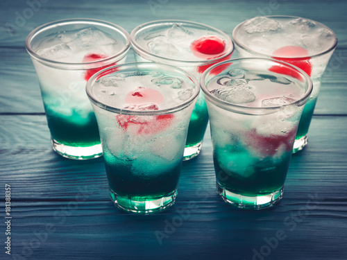 Wallpaper Mural Short alcohol green drinks with cherry and crushed ice. Christmas Saint Patrick day holiday shot Torontodigital.ca