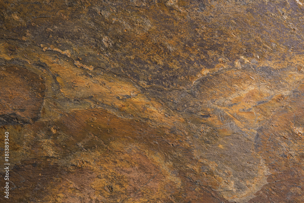 Natural rough stone background brown.
