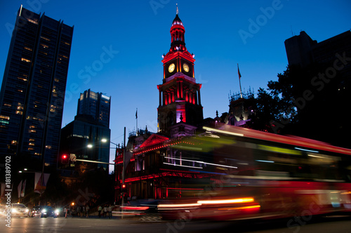 Photography Light moving of bustling city center scene with old clock tower