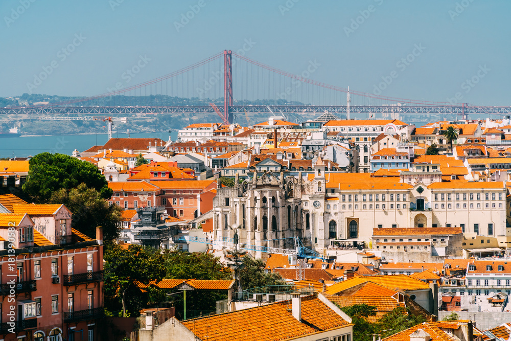 Aerial View Of Downtown Lisbon Skyline Of The Old Historical City And 25 de Abril Bridge (25th April Bridge) In Portugal