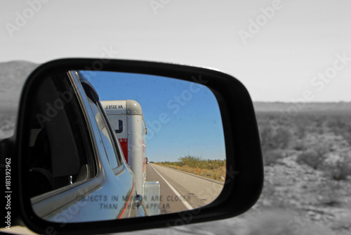 Quadro su tela PHOENIX AZ - OCTOBER 04: car side mirror with view  U-Haul behind Phoenix Arizon