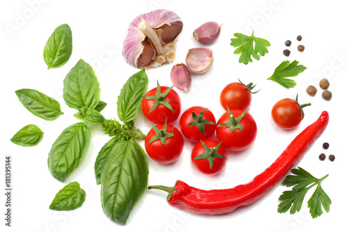 slice of tomato with chili pepper, garlic and parsley isolated on white background. top view