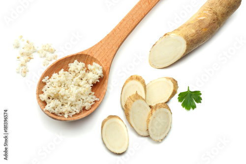 Wallpaper Mural sliced horseradish root with parsley isolated on white background