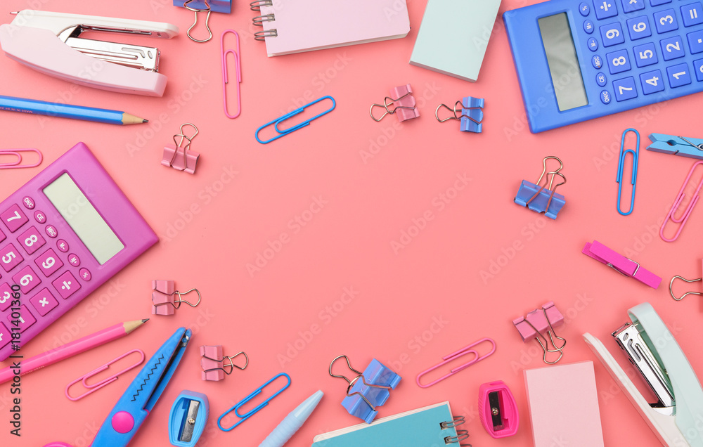 Stationary concept, Flat Lay top view Photo of Scissors, pencils, paper clips,calculator,sticky note,stapler and notepad in pink and blue tone on pink background with copy space Stationary concept, Flat Lay top view Photo of Scissors, pencils, paper clips,calculator,sticky note,stapler and notepad in pink and blue tone on pink background with copy space