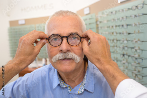 ophthalmologist checking glasses the eyes