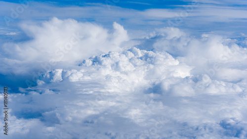 Fluffy White Clouds from Above. clouds and sky