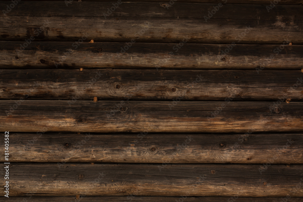 Obraz premium Decorative dark brown wooden slabs. Wood background