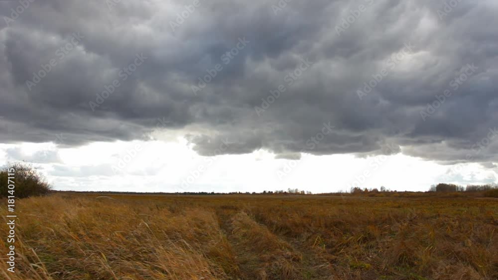 Autumn landscape. Storm Cloudy sky over the field Autumn landscape. Storm Cloudy sky over the field
