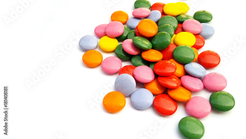 Colorful chocolate candies on white background