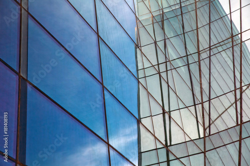 Building glass . Clouds Reflected in Windows of Modern Office Building.
