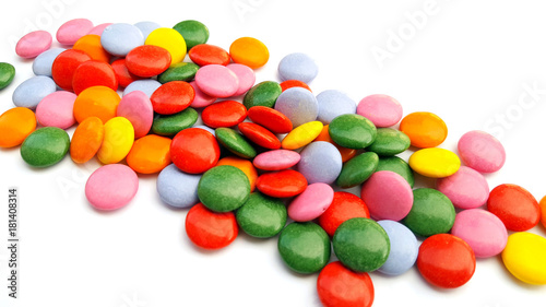 Colorful chocolate candies on white background