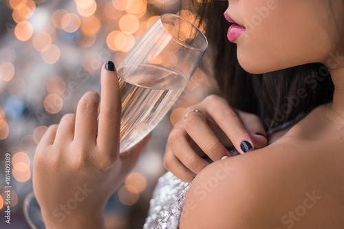 Photography Close up lips of attractive young Asian girl with glass of champagne