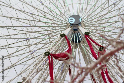 Lille, France, Christmas Market 2017 with Ferris wheel, big tree, lights and market stalls photo