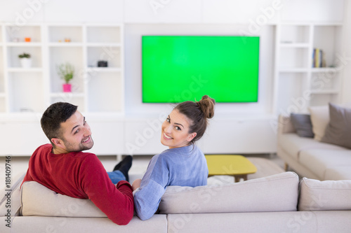 Young couple on the sofa watching television © .shock