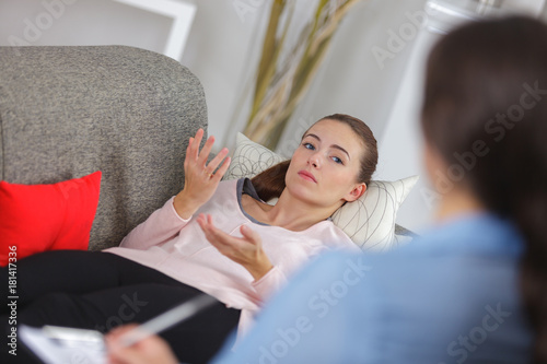 Fotografie young woman lying on couch at doctors office