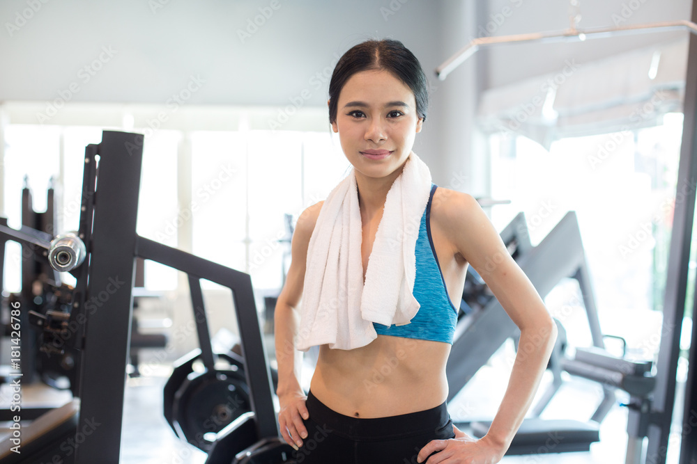 Attractive Asian Woman on exercise bikes at a gym. Woman exercise Concept. Attractive Asian Woman on exercise bikes at a gym. Woman exercise Concept.