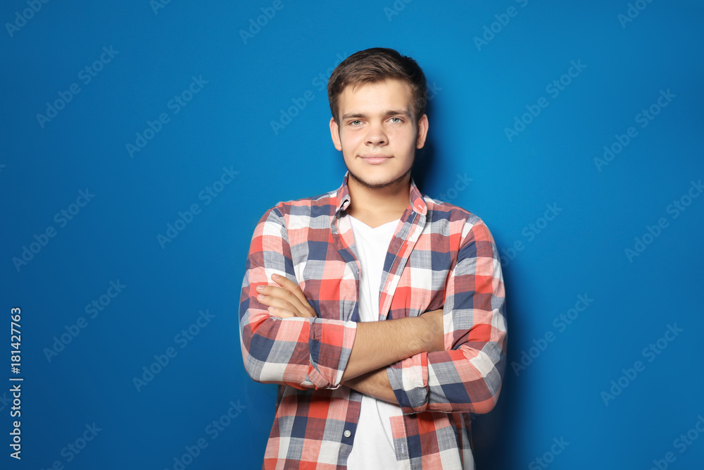Teenager boy in casual clothes on color background Teenager boy in casual clothes on color background