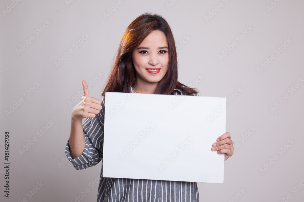 Young Asian woman show thumbs up with white blank sign. Young Asian woman show thumbs up with white blank sign.