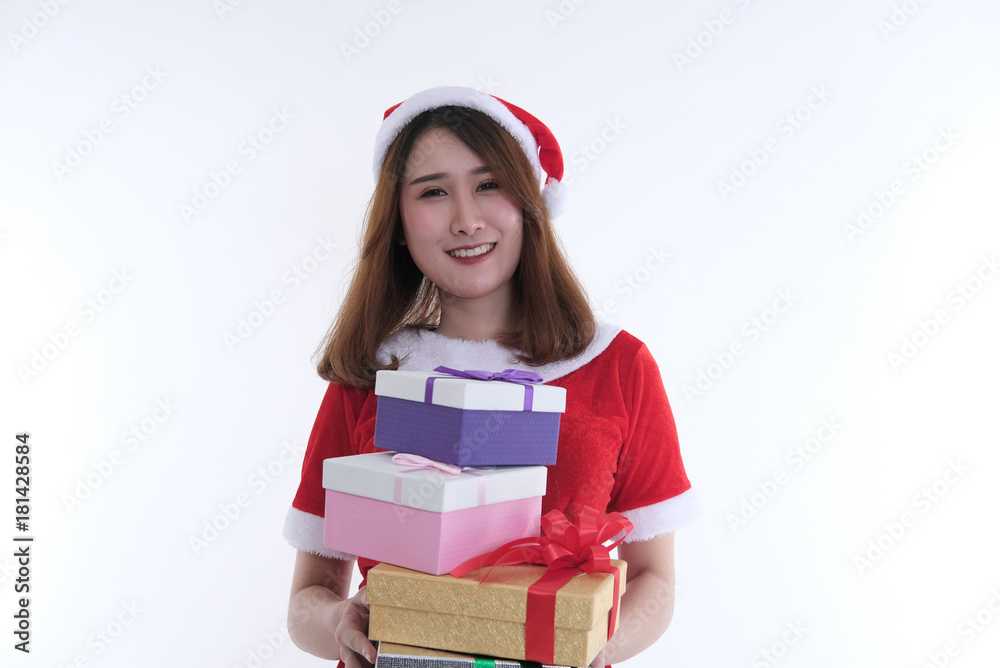 portrait of asian woman in santa claus dress on white background. girl with gift present box. christmas holiday. merry xmas celebration. portrait of asian woman in santa claus dress on white background. girl with gift present box. christmas holiday. merry xmas celebration.