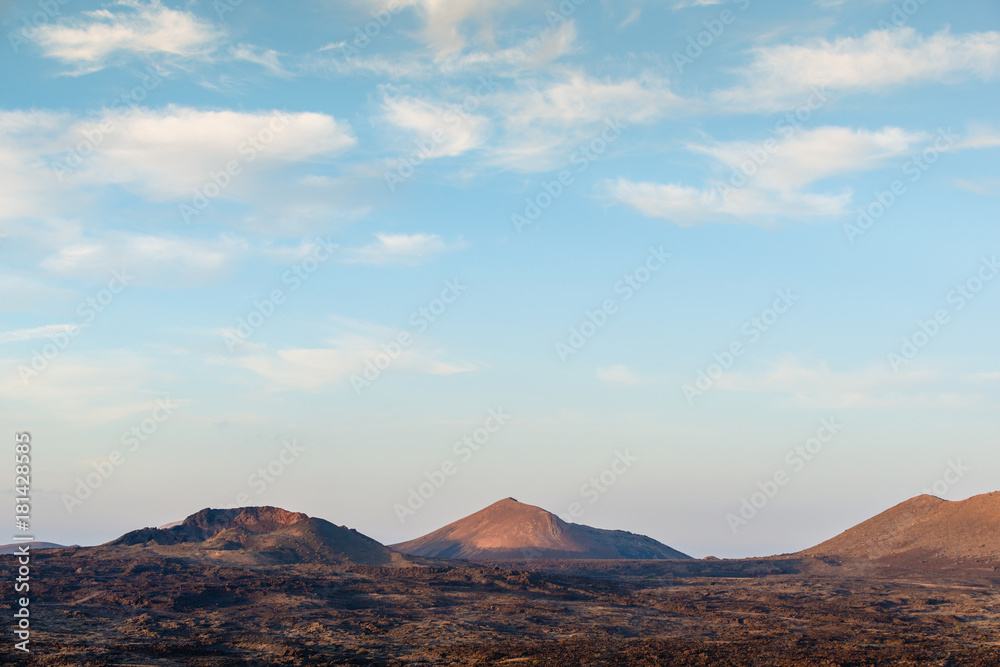 Fototapeta premium Incredible volcanic landscape of Lanzarote at sunset. Canary Islands. Spain.