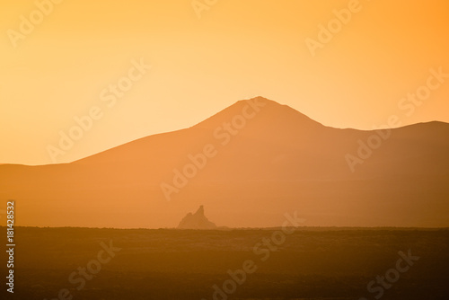 Lonely volcano in the national park of Timanfaya at sunset. Lanzarote. Canary Islands. Spain