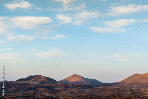 Incredible volcanic landscape of Lanzarote at sunset. Canary Islands. Spain.