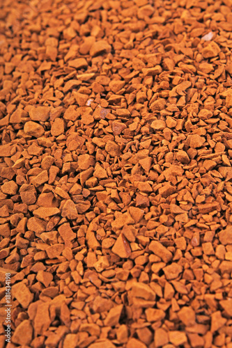 Instant coffee texture background. Brown coffee grains as mars floor stones. Instant coffee dry dried grains. Food photo.