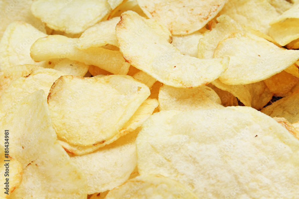 Chips pattern. Yellow salted potato chips as background. Chips texture studio food photo. Chips pattern. Yellow salted potato chips as background. Chips texture studio food photo.