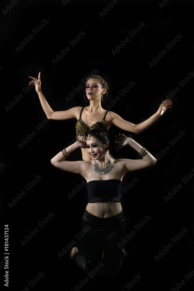 Attractive two asian woman showing belly dance