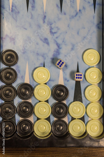 Game field in a backgammon with dice and checkers