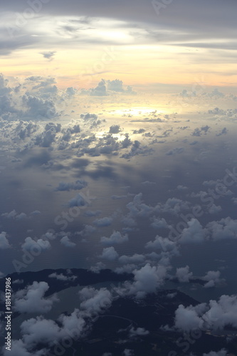 Sunset White Cloud sky at high level attitude  view from window airplane