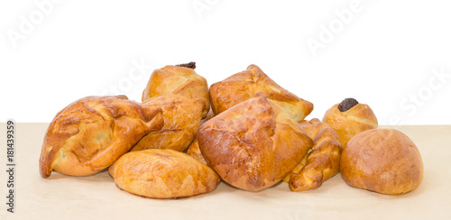 Pile of the different sweet bakery products on a parchment paper