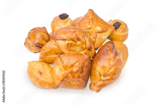 Pile of the different sweet pies on a white background